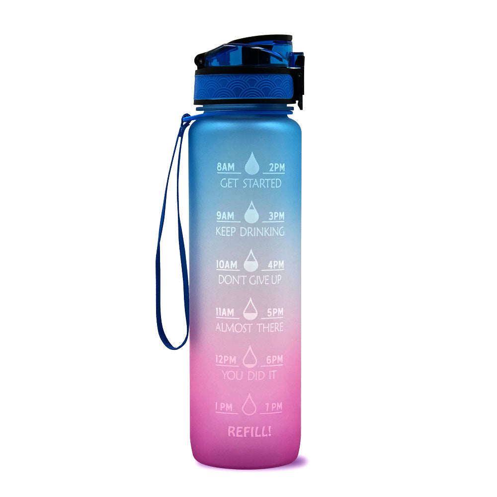 Gradient blue to pink 1L Tritan bottle on a white background