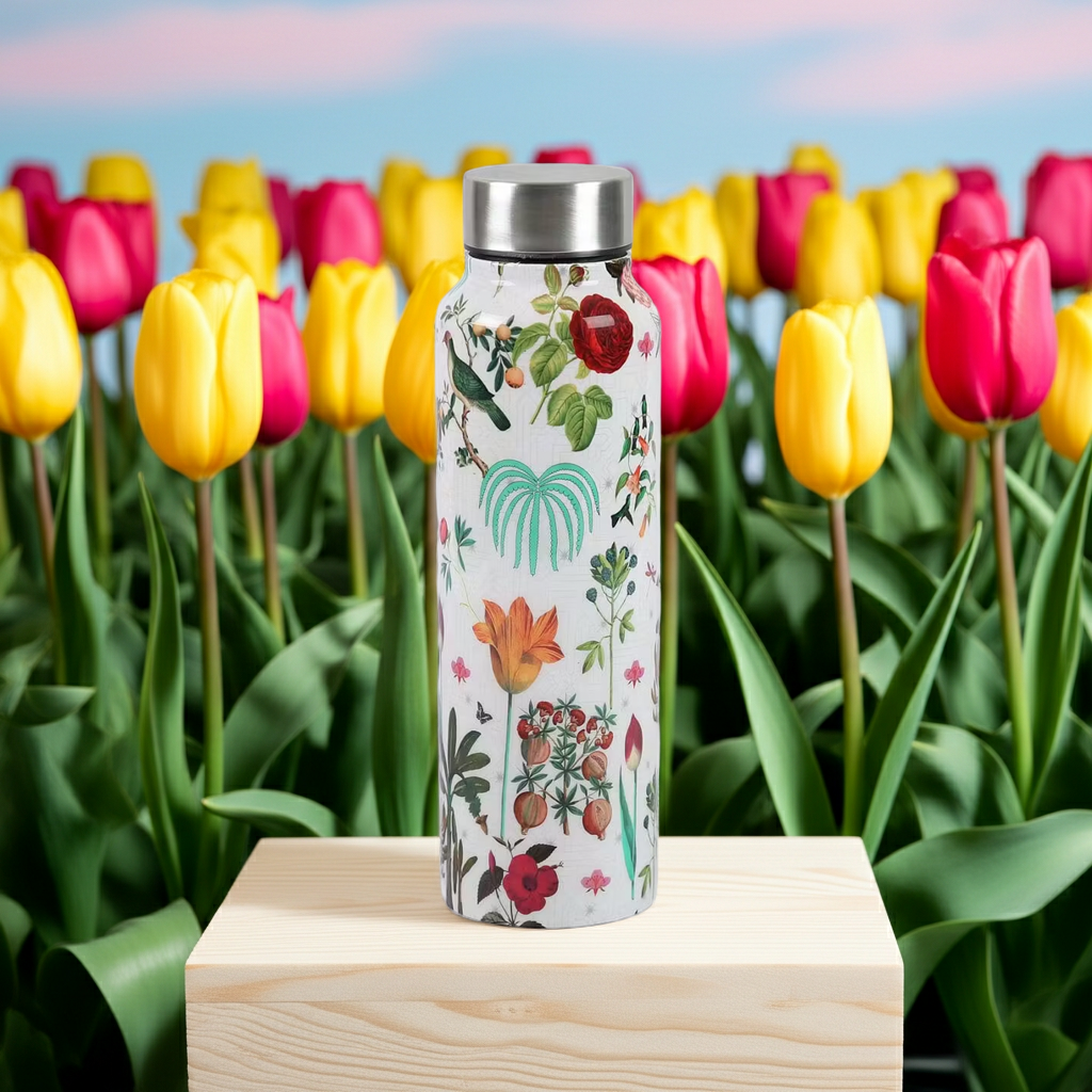Petal and Plume Big Steel Bottle 750 mL surrounded by spring flowers