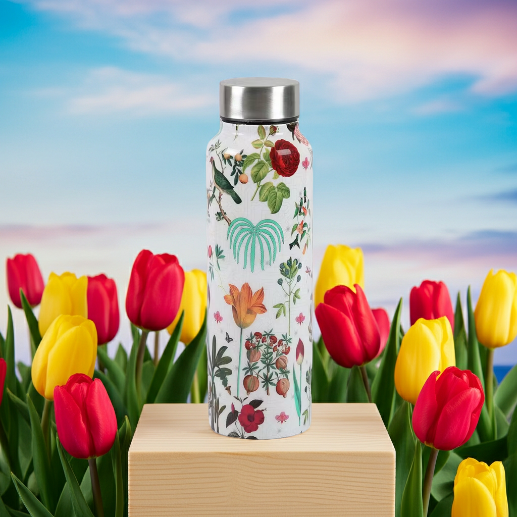 Petal and Plume Big Steel Bottle 750 mL on a wooden block with red and yellow flowers