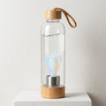 CrystalAura 550ml Gemstone Glass Water Bottle in a clean art gallery background