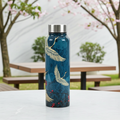 Legend of the Cranes Big Steel Bottle 750 mL atop a picnic table on a spring day