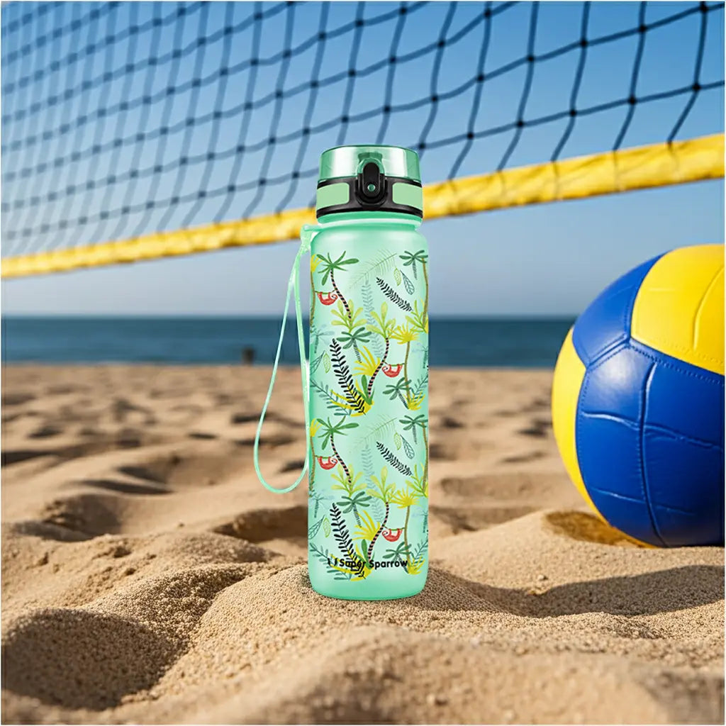 Super Sparrow Tritan Sports Water Bottle on a beach under a volleyball net 