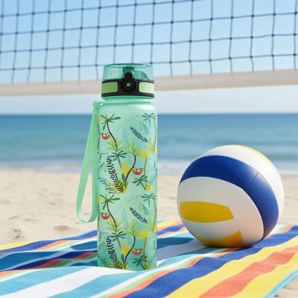 Super Sparrow Tritan Sports Water Bottle on a beach blanket under a volleyball net next to a multicolor ball